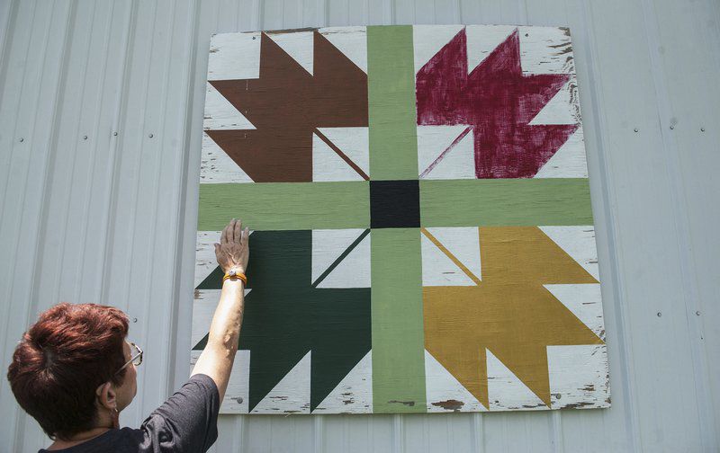 Area resident uses rural structures as backdrops for folk art